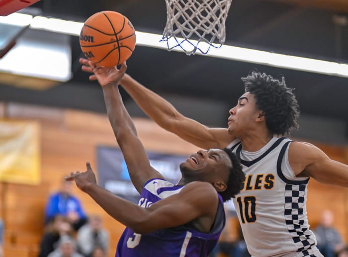 Isaac Williams (10) and St. Augustine's Jaden Bailes (3) battle for loose ball.